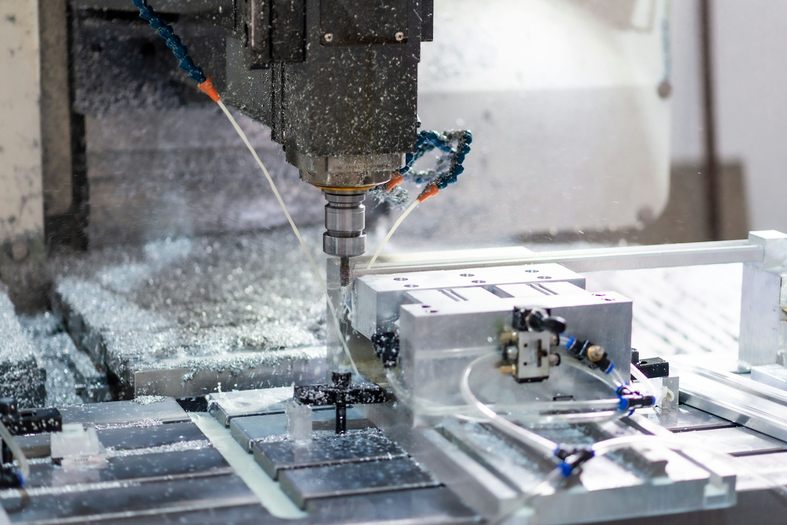 A machine that is cutting a piece of metal